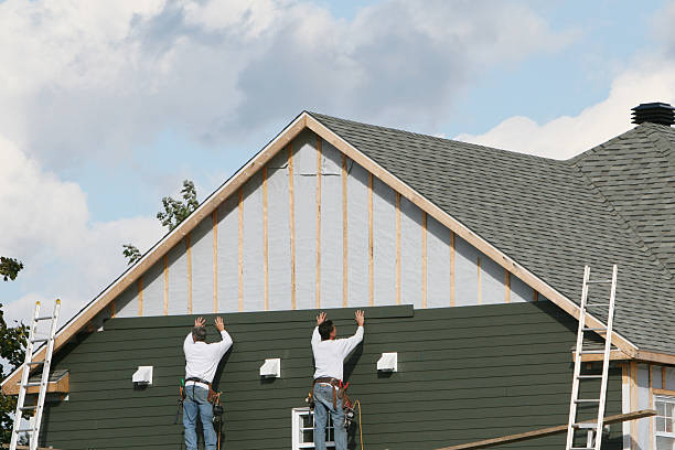 Professional Storm Damage Siding Repair technician working in Winfield, WV